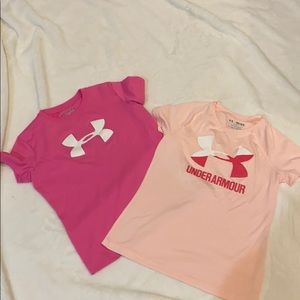 Loose fitting Under Armour YM athletic shirts.